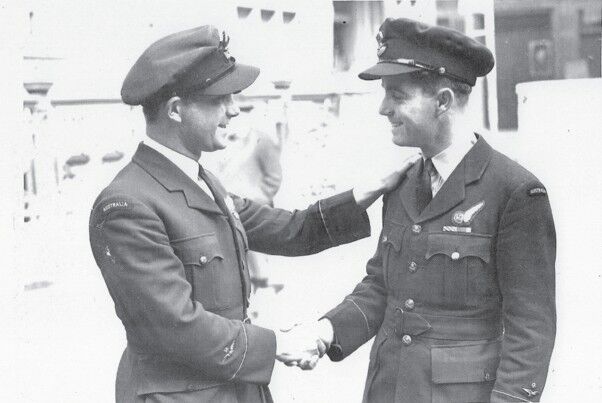 Ray Merrill right being congratulated by his brother