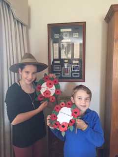 Great grandchildren Henry and Ava Riesewyk paying tribute with their wreathes.